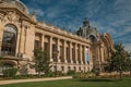 People and garden in front the Petit PalaisÃ¢â¬â¢s facade in Paris.